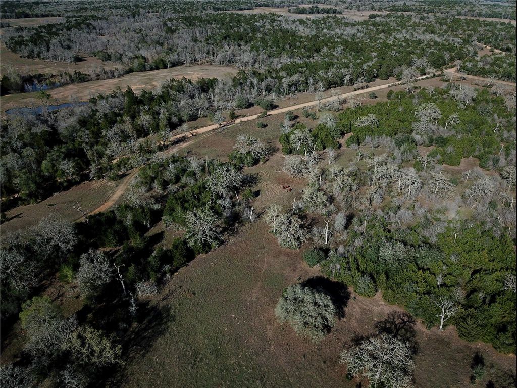 Aerial view showing creek and road access